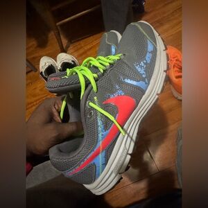 Nike Gray Athletic Shoes with Neon Green Laces and Red Swoosh